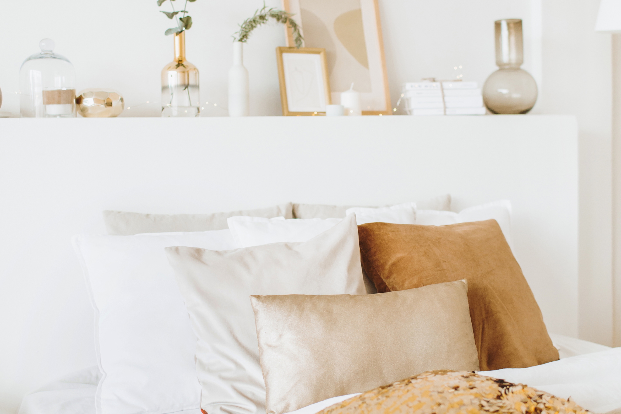 A modern bed with decorative elements on the headboard