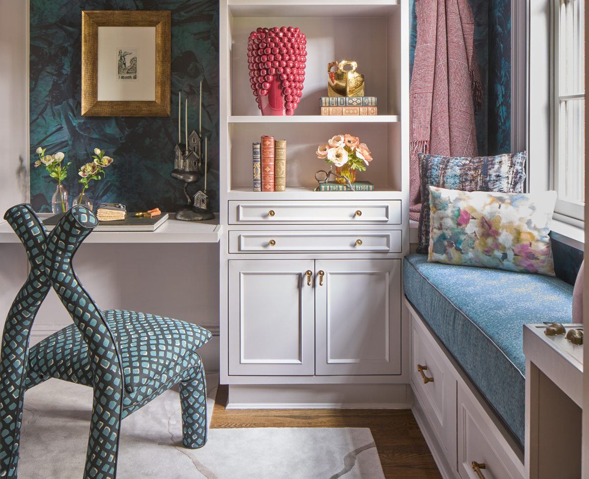 A writer\'s studio design concept by Studio Jai features deep pastel hues wallpaper, upholstery and decorative arts on light paint-finished built-in furniture