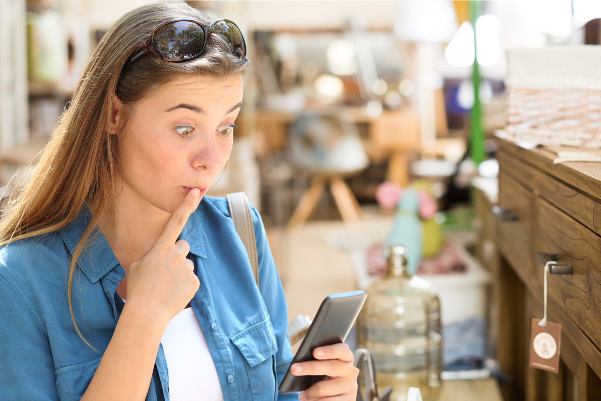 A woman makes mistake as she shops an antique store