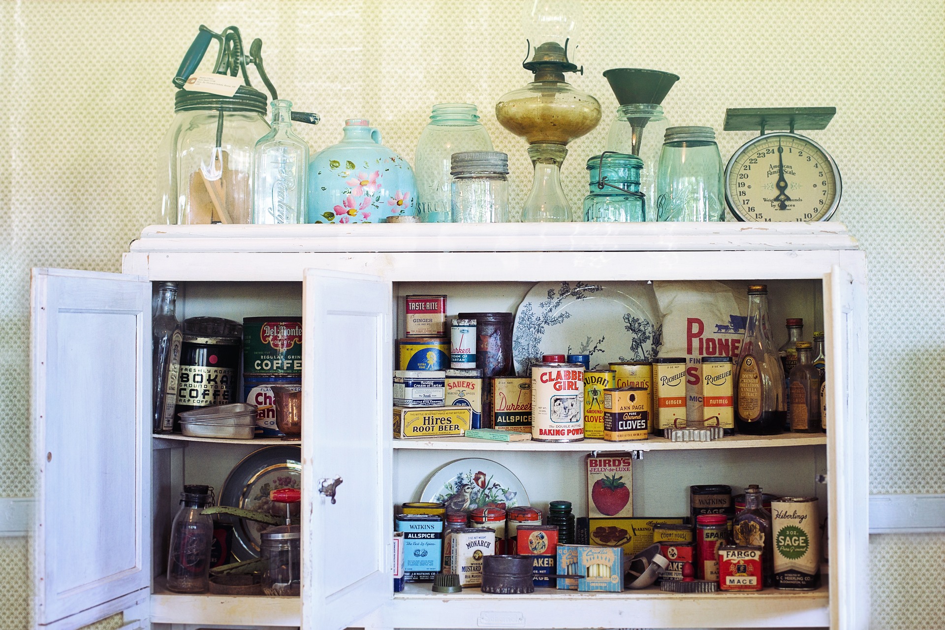 Vintage kitchenware in cabinet