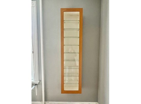 A Modern Hanging Cabinet With Glass Shelves