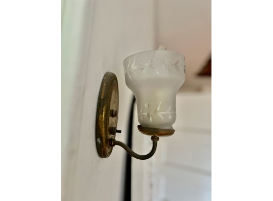 A Pair Of Antique Wall Sconces With Frosted Shades