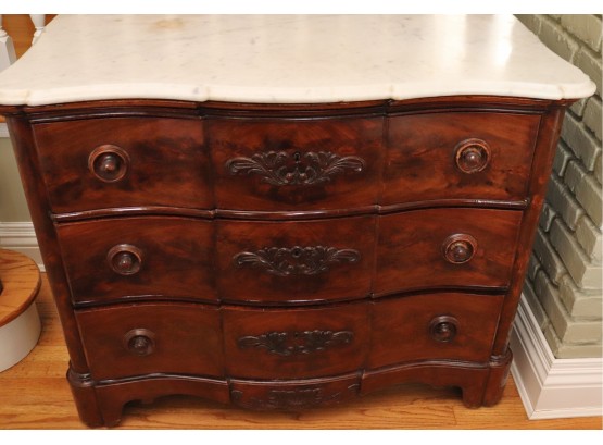 Victorian Mahogany Chest Of Drawers With Beveled Marble Top And Serpentine Front.