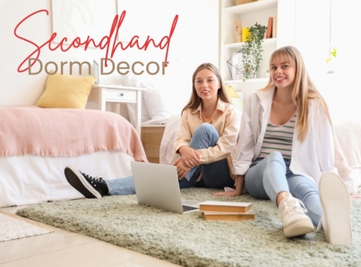 Two college students sit on the floor of their dorm room.