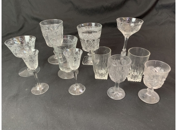 Assortment Of Clear Glass Cups And Cocktail Glasses