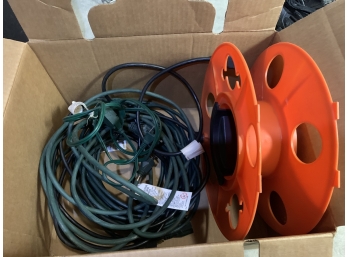 Extension Cords And A Manual Roll Up Wheel