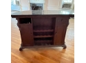 A Moveable Granite Top Bar With Bar Brass Rail