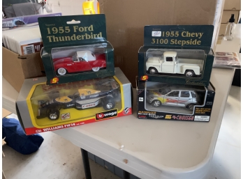Four Model Cars Still In Boxes